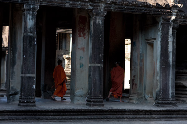 Monks in a corridor in Angkor Wat