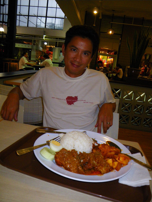 George enjoying the Malaysian dish, Nasi Lemak