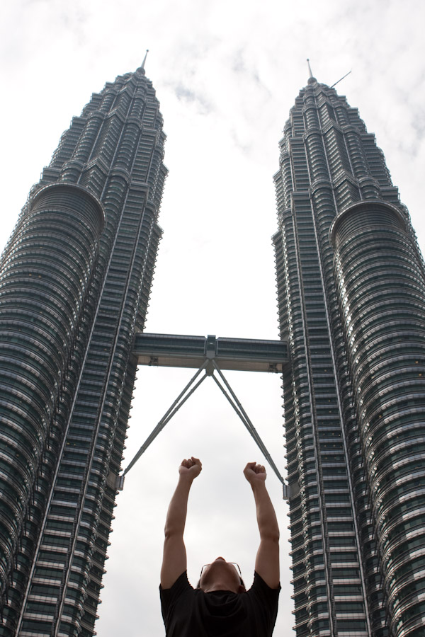 George flying up to the top of the Petronas Towers