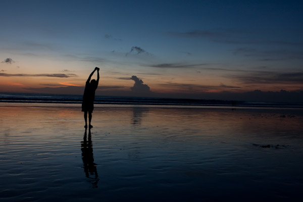 George doing yoga on the beach, Bali