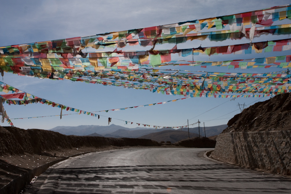 Prayer flags marking the top of a pass, Tibet