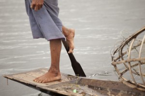 Fisherman on Inle Lake Paddling with His Foot
